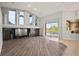 Open-concept living area with fireplace and access to outdoor pool area at 10101 Paddock Oaks Dr, Riverview, FL 33569