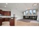 Open layout featuring living room connected to kitchen island and bar at 10101 Paddock Oaks Dr, Riverview, FL 33569