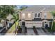 Aerial view of townhome featuring well-manicured landscaping and parking at 1031 Andrew Aviles Cir, Tampa, FL 33619