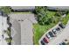 Overhead view of townhome roof and rear parking, complimented by green space at 1031 Andrew Aviles Cir, Tampa, FL 33619