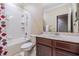 Traditional bathroom showcasing a tub-shower combo and a wood vanity at 1031 Andrew Aviles Cir, Tampa, FL 33619