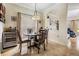 Cozy dining area featuring modern light fixture, wine cooler, and decorative art at 1031 Andrew Aviles Cir, Tampa, FL 33619