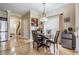 Cozy dining area featuring a modern chandelier and a table set for four with adjacent kitchen at 1031 Andrew Aviles Cir, Tampa, FL 33619
