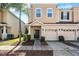 Charming townhome featuring a well-maintained lawn, a one-car garage, and neutral colored stucco at 1031 Andrew Aviles Cir, Tampa, FL 33619