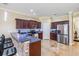 Bright, open kitchen featuring stainless steel appliances, granite countertops, breakfast bar and dark wood cabinetry at 1031 Andrew Aviles Cir, Tampa, FL 33619