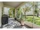 Inviting screened lanai with potted plants and views of the lush outdoors at 1031 Andrew Aviles Cir, Tampa, FL 33619