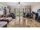 Spacious living room with ample natural light, backyard views, and neutral wall color at 1031 Andrew Aviles Cir, Tampa, FL 33619