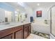 Bright main bathroom with double vanity, soaking tub, and walk-in shower at 1031 Andrew Aviles Cir, Tampa, FL 33619