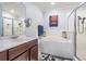Clean main bathroom featuring soaking tub, shower, and decorative accents at 1031 Andrew Aviles Cir, Tampa, FL 33619