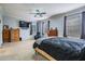 Spacious main bedroom featuring large bed, TV, and dual windows for natural light at 1031 Andrew Aviles Cir, Tampa, FL 33619