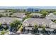 Charming townhomes feature attached garages and inviting curb appeal amidst lush, mature landscaping at 1031 Andrew Aviles Cir, Tampa, FL 33619