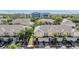 Charming townhomes feature attached garages and inviting curb appeal amidst lush, mature landscaping at 1031 Andrew Aviles Cir, Tampa, FL 33619