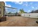 Expansive paved backyard with a built-in grill, perfect for outdoor entertaining and relaxation by the pool at 10327 Meadow Crossing Dr, Tampa, FL 33647
