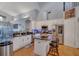 Bright kitchen with stainless steel appliances, granite countertops, and a kitchen island with bar stool seating at 10327 Meadow Crossing Dr, Tampa, FL 33647