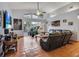 Spacious living room with high ceilings, tile flooring, and access to the screened-in pool area at 10327 Meadow Crossing Dr, Tampa, FL 33647