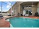 Relaxing screened-in outdoor pool area, perfect for enjoying Florida's warm weather with covered lanai at 10327 Meadow Crossing Dr, Tampa, FL 33647