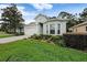 Well maintained single story home featuring lush landscaping and an attached two-car garage at 11220 Paradise Pointe Way, New Port Richey, FL 34654