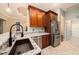 Kitchen island with stainless steel appliances and granite countertops at 11220 Paradise Pointe Way, New Port Richey, FL 34654
