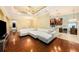 Cozy living room with hardwood floors, adjacent dining area, and open layout to kitchen at 11220 Paradise Pointe Way, New Port Richey, FL 34654