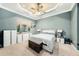 Bright main bedroom with tray ceilings and neutral decor at 11220 Paradise Pointe Way, New Port Richey, FL 34654