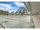 Community shuffleboard courts with covered walkways and seating at 11220 Paradise Pointe Way, New Port Richey, FL 34654