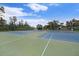 Well-maintained tennis courts, offering a recreational amenity for active residents at 11220 Paradise Pointe Way, New Port Richey, FL 34654