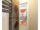 Open doorway to a bathroom showing a stylish sink and a decorative shower curtain at 12529 Knollbrook Ln, Hudson, FL 34669