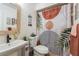 The bathroom features a stylish vanity, modern sink, and unique shower curtain at 12529 Knollbrook Ln, Hudson, FL 34669