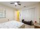 Bright bedroom with a ceiling fan and a view of the closet at 12529 Knollbrook Ln, Hudson, FL 34669
