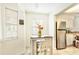 Bright breakfast nook with white cabinetry, stainless appliances and wood flooring at 12529 Knollbrook Ln, Hudson, FL 34669