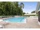 Enjoy the community pool with a spacious deck and ample seating for residents at 12529 Knollbrook Ln, Hudson, FL 34669