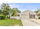 Charming single-Gathering home with manicured lawn, attached garage, and enclosed front porch at 12529 Knollbrook Ln, Hudson, FL 34669