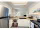 Kitchen featuring stainless steel appliances and white cabinets at 12529 Knollbrook Ln, Hudson, FL 34669