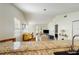 Bright living room featuring vaulted ceilings, wood floors, and natural light at 12529 Knollbrook Ln, Hudson, FL 34669