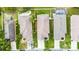 Aerial view highlighting neighborhood homes with well-maintained lawns and driveways at 12631 Chenwood Ave, Hudson, FL 34669