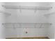 Walk-in closet featuring metal shelving at 12631 Chenwood Ave, Hudson, FL 34669