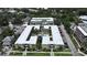Aerial view showcasing complex layout, courtyard pool, landscaping, and nearby parking at 1301 S Howard Ave # A9, Tampa, FL 33606