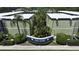 Aerial view of the complex, showcasing landscaped courtyard with tropical trees at 1301 S Howard Ave # A9, Tampa, FL 33606