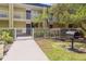 Landscaped community grounds with courtyard grilling area at 1301 S Howard Ave # A9, Tampa, FL 33606