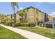 Exterior view of 1301 SOHO Condominiums with lush landscaping and a manicured lawn at 1301 S Howard Ave # A9, Tampa, FL 33606