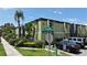 Street view of condo complex with mature landscaping, near South Howard Ave and W Southview Ave at 1301 S Howard Ave # A9, Tampa, FL 33606