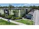 Exterior shot of condo complex features mature tropical landscaping near South Howard street at 1301 S Howard Ave # A9, Tampa, FL 33606