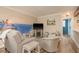 Inviting living room featuring comfortable seating and nautical-themed wall art at 1301 S Howard Ave # A9, Tampa, FL 33606