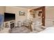 Comfortable living room showcasing a TV, mural, and seamless kitchen access at 1301 S Howard Ave # A9, Tampa, FL 33606