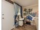 Bright office area featuring a desk, chair, shelving, and mural at 1301 S Howard Ave # A9, Tampa, FL 33606