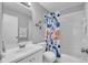 Bathroom with a shower and bathtub combination, white tile and a -friendly shower curtain at 1312 Kelridge Pl, Brandon, FL 33511