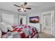 Primary bedroom featuring ceiling fan, dresser, and bath ensuite at 1312 Kelridge Pl, Brandon, FL 33511