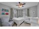 Bedroom with a crib, chair and book collection at 1312 Kelridge Pl, Brandon, FL 33511