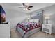 Primary bedroom with ceiling fan and cozy quilt-covered bed at 1312 Kelridge Pl, Brandon, FL 33511