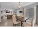 Comfortable dining area with chandelier, open layout to the living room, and natural light at 1312 Kelridge Pl, Brandon, FL 33511